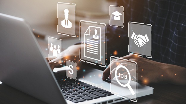 Human using a computer laptop for searching for job and fill out personal data on job website to file a resume and apply application to jobs on the internet. work search online concept.