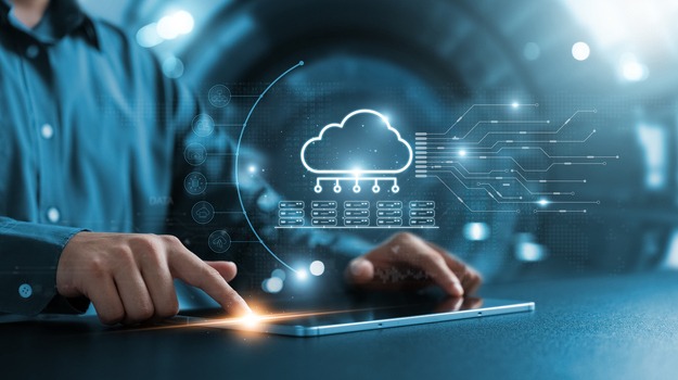 Businessman using tablet to transfer data on cloud computing, seamless data transfer and strong internet security, server based communication on social networks, servers and storage.