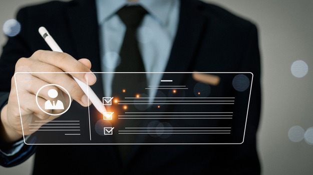 Businessman filling out online employee appraisal form. Human resource management (HR), recruiting, leadership and team building.business people check marks on checklist.