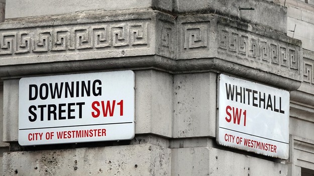 Downing Street and Whitehall signs in Westminster, London, UK.